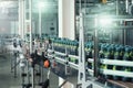 Industrial beverage factory interior. Conveyor with packaging of bottles with juice Royalty Free Stock Photo