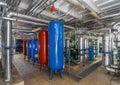 Industrial boiler interior with lots of pipes, pumps and valves