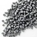Industrial bolts and hex nuts in dense overlay pattern Royalty Free Stock Photo
