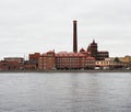 industrial brick building on the river bank