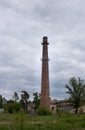 Tall brick chimney, old building heating system Royalty Free Stock Photo