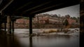 Industrial building framed by bridge spanning Haw river Royalty Free Stock Photo