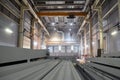 Industrial building interior. In the foreground are finished metal structures