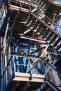 Industrial building structure fragment featuring metal staircases tubes and pillars. Abstract image concept of modern Royalty Free Stock Photo