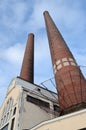 Industrial building and two brick chimney Royalty Free Stock Photo