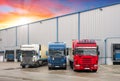 Industrial building and warehouse with freight trucks - Logistic Royalty Free Stock Photo