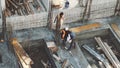 Industrial Building Workers Doing Job Raw Fundament Concrete Cement Using Tools Hard Job Labor Construction In Progress