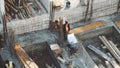 Industrial Building Workers Doing Job Raw Fundament Concrete Cement Using Tools Hard Job Labor Construction In Progress