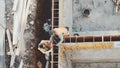 Industrial Building Workers Doing Job Raw Fundament Concrete Cement Using Tools Hard Job Labor Construction In Progress