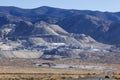 Industrial buildings built next to large tailing piles on a mountain in Gabbs Nevada Royalty Free Stock Photo