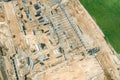 Industrial buildings under construction. aerial view of big construction site with building materials Royalty Free Stock Photo