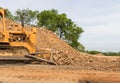 Industrial bulldozer moving earth pit or quarry Royalty Free Stock Photo