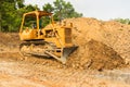 Industrial bulldozer moving earth pit or quarry Royalty Free Stock Photo