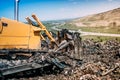 Industrial bulldozer working on garbage dumping site Royalty Free Stock Photo