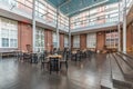 Industrial cafe or restaurant Interior with tables and chairs in a former factory building