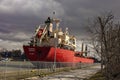 Industrial cargo ship sailing down the Welland Canal. Royalty Free Stock Photo