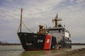 Industrial cargo ship sailing down the Welland Canal. Royalty Free Stock Photo