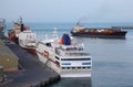 Industrial cargo ships and cruise liner at port