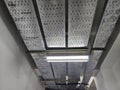 Industrial Ceiling with Cable Trays and Fluorescent Light Royalty Free Stock Photo
