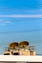 Industrial chiller air conditioning condenser units on rooftop with blue sky