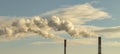 Industrial chimneys on a background of a cloudy sky, a long plume of smoke from chimneys, the concept of protecting nature or