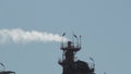 Industrial chimneys expelling smoke in a refinery