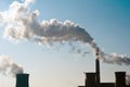 Industrial chimneys with heavy smoke causing air pollution Royalty Free Stock Photo