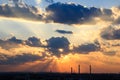 Industrial city silhouette against the sky on a sunset. Royalty Free Stock Photo