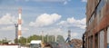 Industrial cityscape of manufacturing area district with tall pipe and scrap metal reception under blue sky at summer day. Ecology Royalty Free Stock Photo