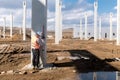 Industrial civil engineer working on construction site. Professional surveyor measuring level Royalty Free Stock Photo