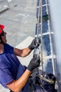 Industrial climber is prepare, adjust his ropes