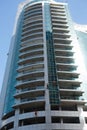 Industrial climber wash the windows of modern skyscraper. Dubai UAE.