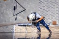 Industrial climber is washing, cleaning facade of a modern office building Royalty Free Stock Photo