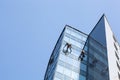 industrial climbers clean windows of high-rise buildings Royalty Free Stock Photo