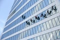 Industrial climbers wash the Windows of a modern skyscraper. window Cleaners wash the glass facade Royalty Free Stock Photo