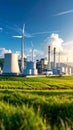 Industrial complex with wind turbines and cooling towers generating power under blue sky Royalty Free Stock Photo