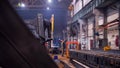 Industrial concept. A crane put down the detail on the floor and man worker taking it