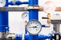 Industrial concept. equipment of the boiler-house, - valves, tubes, pressure gauges, thermometer. Close up of manometer, pipe, fl