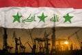 Industrial concept with Iraq flag at sunset