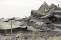 Industrial concrete building destructed by strike. Disaster scene full of debris, dust and crashed buildings Royalty Free Stock Photo