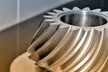 Industrial conical gear with spiral machine teeth.