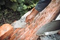 Industrial Construction bricklayer worker building walls with bricks, mortar and trowel Royalty Free Stock Photo