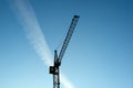 Industrial construction crane silhouettes over sun. sky background Royalty Free Stock Photo