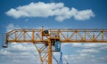 Industrial construction cranes and building silhouettes over sun at sunrise Royalty Free Stock Photo