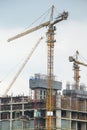 Industrial construction cranes working in the day life. Royalty Free Stock Photo