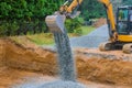 Industrial construction of foundation excavator moving gravel for building Royalty Free Stock Photo