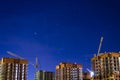 Industrial construction night city crane night stars sky.