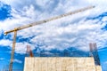 Industrial construction site with mega crane and reinforced steel concrete walls closeup