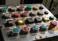 Industrial control panel with an array of buttons and switches on a metal surface. Includes various Royalty Free Stock Photo