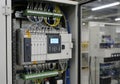 An industrial control panel inside an electrical cabinet features a programmable logic controller Royalty Free Stock Photo